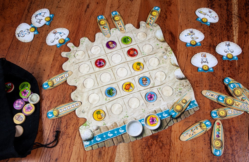 FYFE by Pegasus Spiele is a colorful abstract tile-laying game featuring a sandy-themed board, sea creature tokens, wooden scoring boards, and clam shell-shaped player boards—all set out on a wooden table.