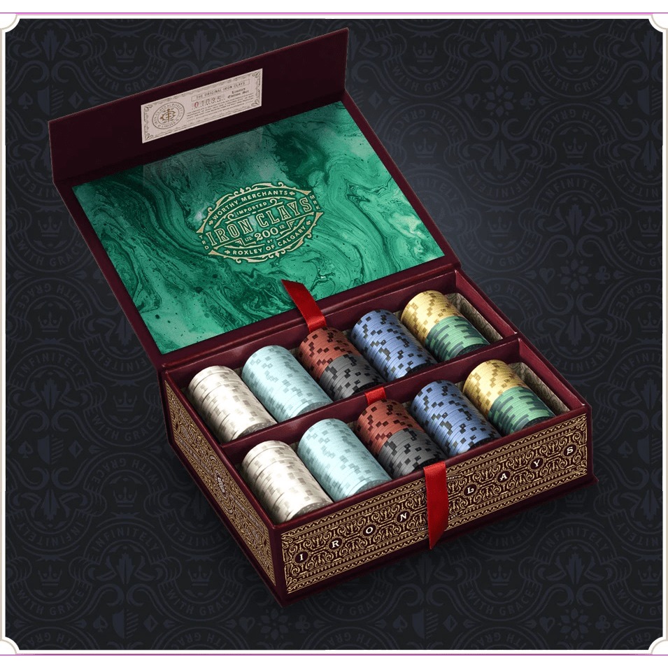 The Iron Clays 200 Printed Box with Chips by Roxley Games features a decorative open box with ornate gold detailing, a green interior with gold lettering, and ten stacks of colorful poker chips—perfect for euro style games.