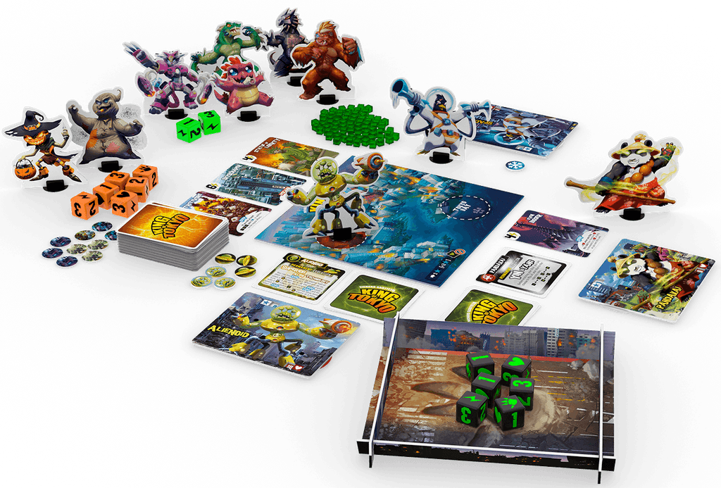 King of Tokyo: Monster Box by Iello shown with character standees, cards, dice, tokens, green cubes, and player boards arranged around the vibrant central game board.