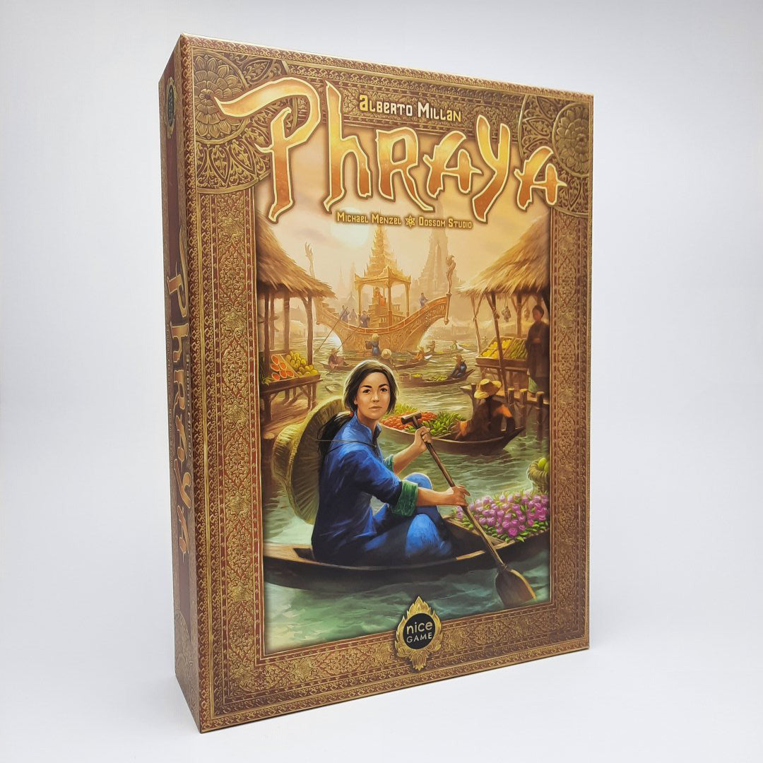 The Phraya DE board game box by Nice Game Publishing showcases ornate borders and depicts a woman paddling a boat at a floating market, set against colorful scenes and traditional Thai architecture in the background.