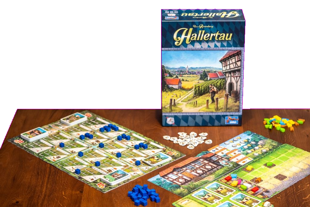 A Hallertau setup by Lookout Games on a wooden table features the game box, player boards with cards and blue pieces, piles of tokens, and colorful wooden pieces—ideal for fans of agriculture-themed worker placement games.
