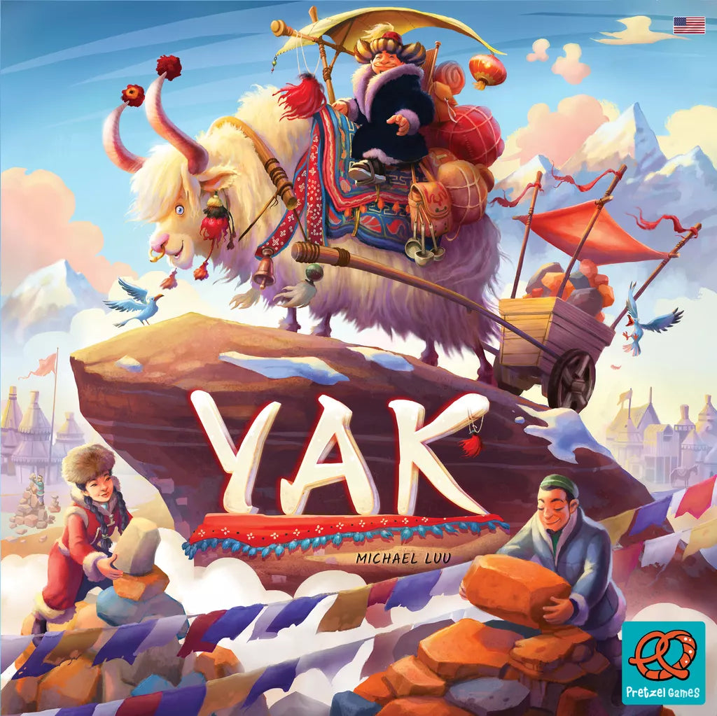 The Yak board game by Asmodee Italia features a cover where a yak pulls a cart with a rider, two people build a stone tower, and "YAK" is displayed on a rock amid snowy villages and the Himalayan mountains.