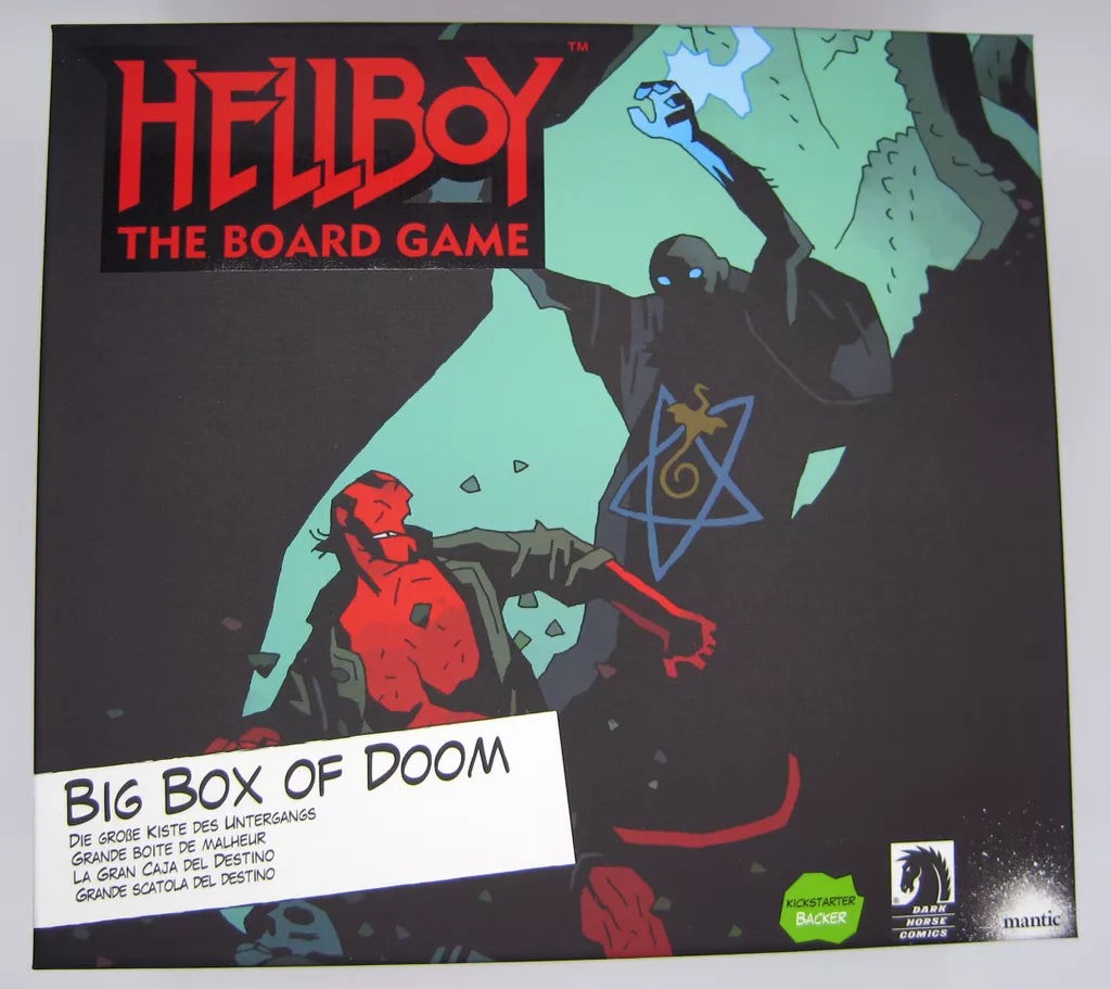 The cover of Hellboy: The Board Game – Big Box Of Doom by Mantic Games features stylized art of Hellboy confronting a shadowy figure with a glowing symbol, along with visible logos for Kickstarter expansions and Mantic Games.