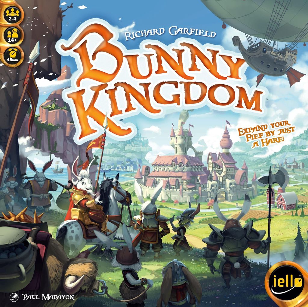 Armored rabbits from a clever clan face a castle in a fantasy land with flying ships above. The strategy board game Bunny Kingdom by Iello is shown, with its title in bold orange letters over the scene.