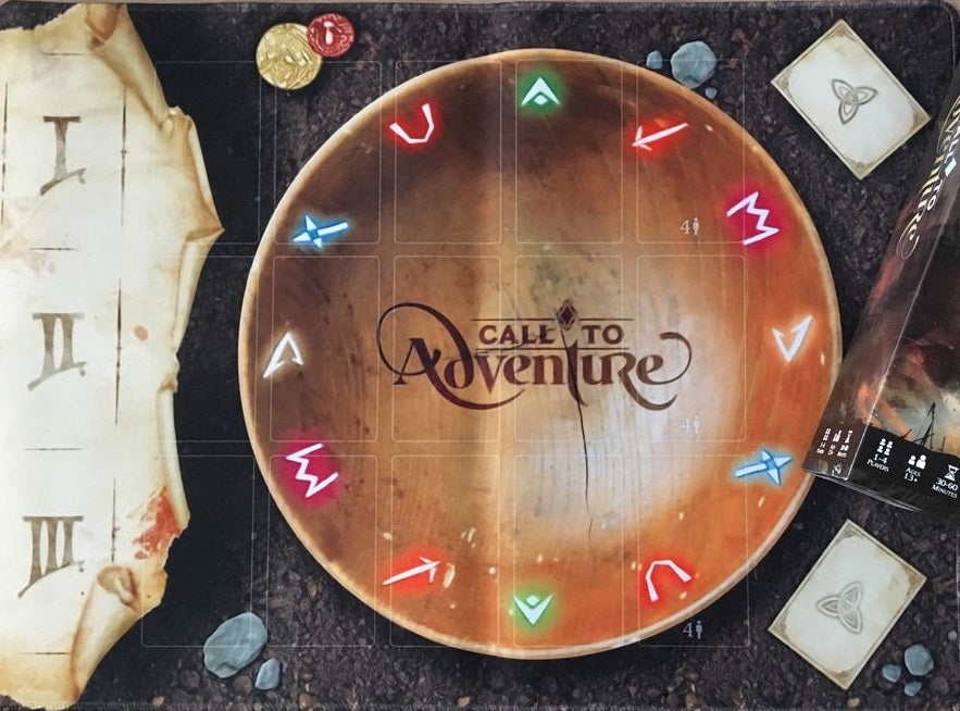 Call to Adventure by Brotherwise Games is a fantasy storytelling board game featuring a glowing runed wooden bowl, coins, cards, stones, and parchment with Roman numerals, all complementing its unique rune rolling system.