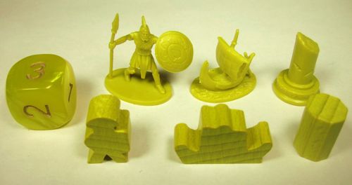 A set of yellow game pieces from Cyclades by Matagot, featuring a Viking warrior with spear and shield, a ship, a column, and abstract wooden shapes, all arranged for Ancient Greek strategy gameplay.