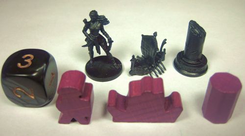 A set of Cyclades board game pieces by Matagot on a white surface: a black die with gold numbers, black mini figure, ship, column, and four purple tokens in various shapes—ideal for Ancient Greek strategy gameplay.