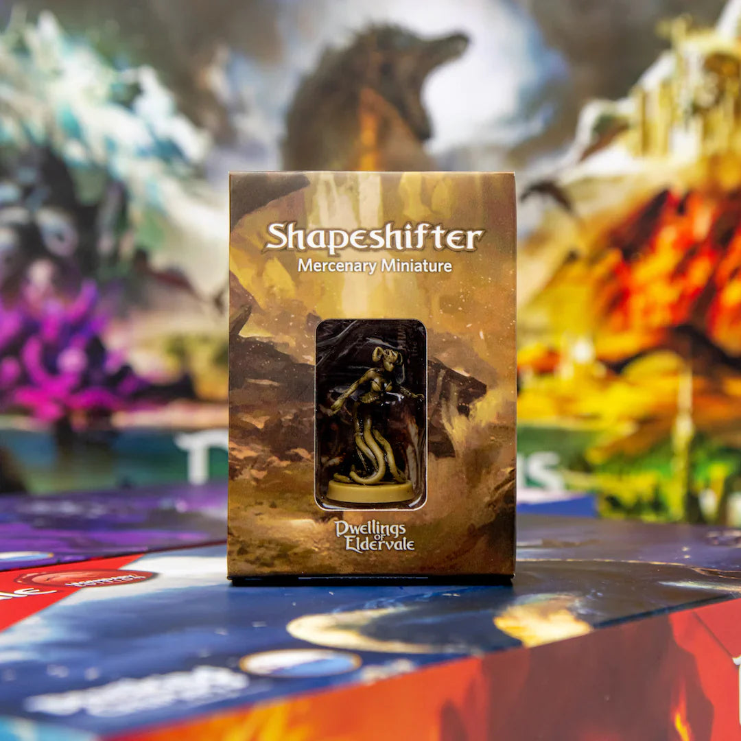 A boxed Dwellings of Eldervale: Shapeshifter Mercenary Miniature by Breaking Games stands on a vibrant, fantasy-themed game board, suggesting an epic board game expansion with swirling colors and mystical imagery.