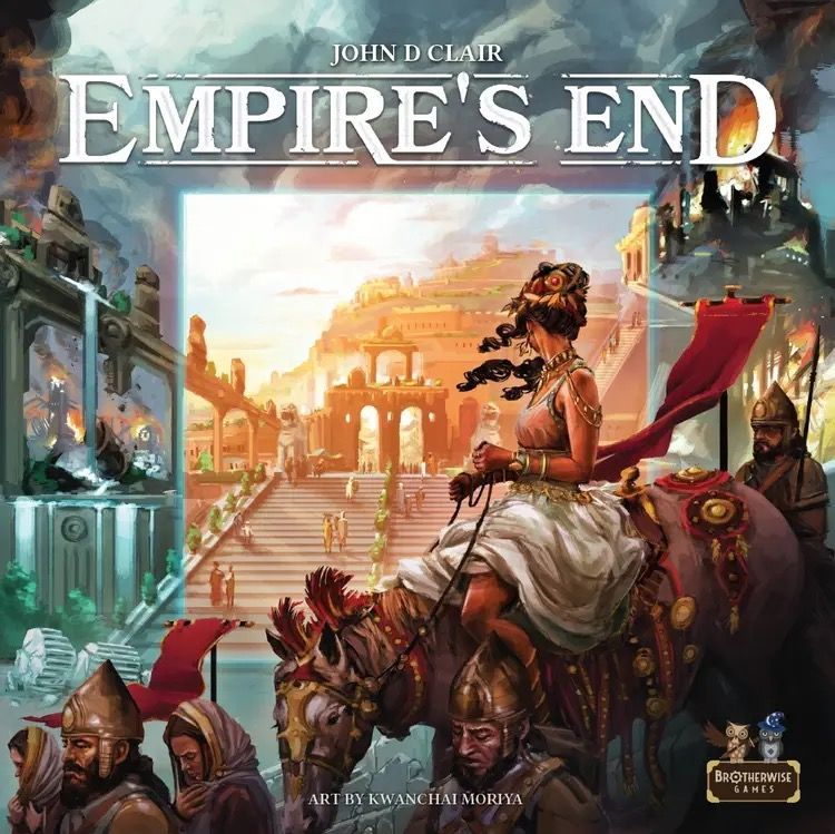 A woman in ornate attire rides a decorated elephant past ancient ruins as people gather near a temple. The text reads, “Empire's End,” a strategy board game with reverse-bidding by Brotherwise Games.