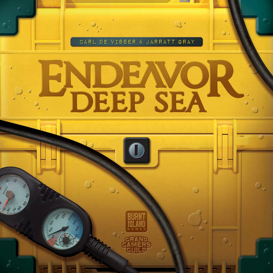 A yellow case labeled "Endeavor: Deep Sea" by Burnt Island Games rests near a pressure gauge and black cable, with water droplets hinting at sustainable ocean exploration. Names “Carl de Visser & Jarratt Gray” appear above.