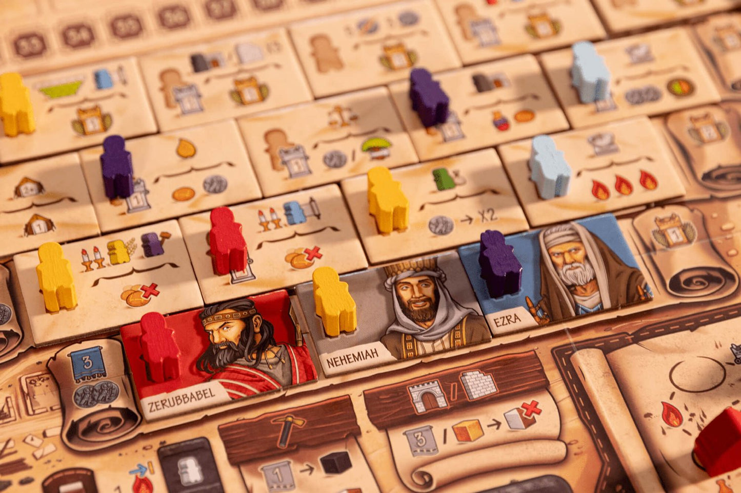 A close-up of Garphill Games' "Ezra and Nehemiah," a strategy board game featuring illustrated character cards, colorful wooden tokens, various resources, and icons depicting Jerusalem's temple on the game board.