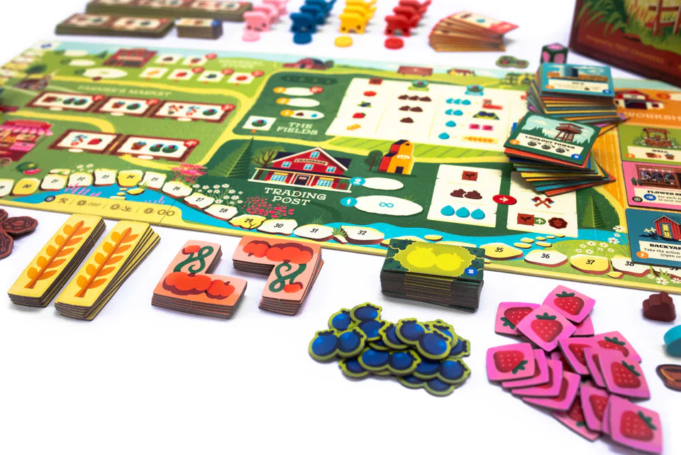 Harvest by Keymaster Games features a vibrant board, illustrated fruit, wheat, and vegetable tokens, and cards—creating an engaging setup that's perfect for resource management and farming strategy game fans.