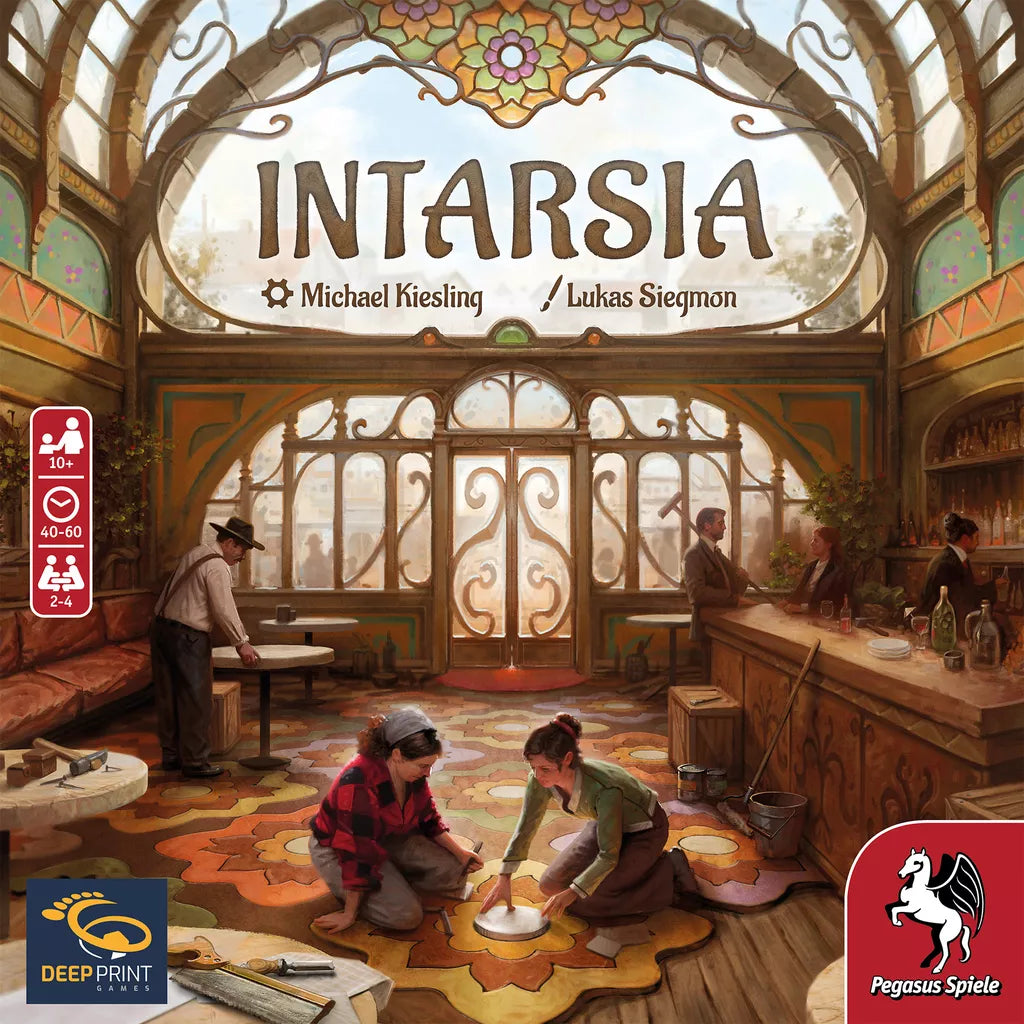 The Intarsia board game by Pegasus Spiele features a cover with a sunlit artisan workshop, where children craft wood designs on a parquet floor and adults work at benches, with stained-glass windows and floral details in the background.