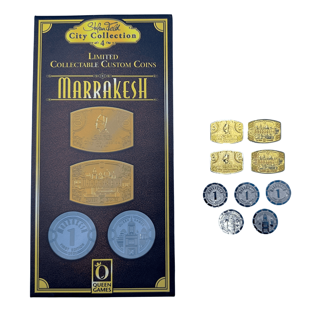The Marrakesh Limited Collectible Custom Coins by Queen Games feature uniquely designed silver and gold coins, displayed with their packaging—perfect for showcasing in a jewelry box.