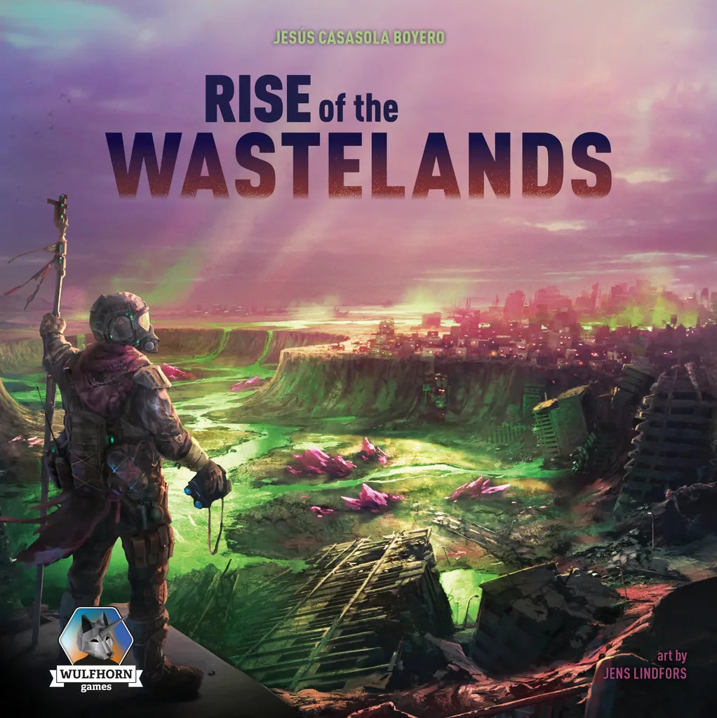 A futuristic armored figure stands on a cliff above neon-lit ruins. Text reads “Rise of the Wastelands Deluxe Kickstarter Edition” by Jesús Casasola Boyero. Manage resources and survive! Wulfhorn Games logo appears.