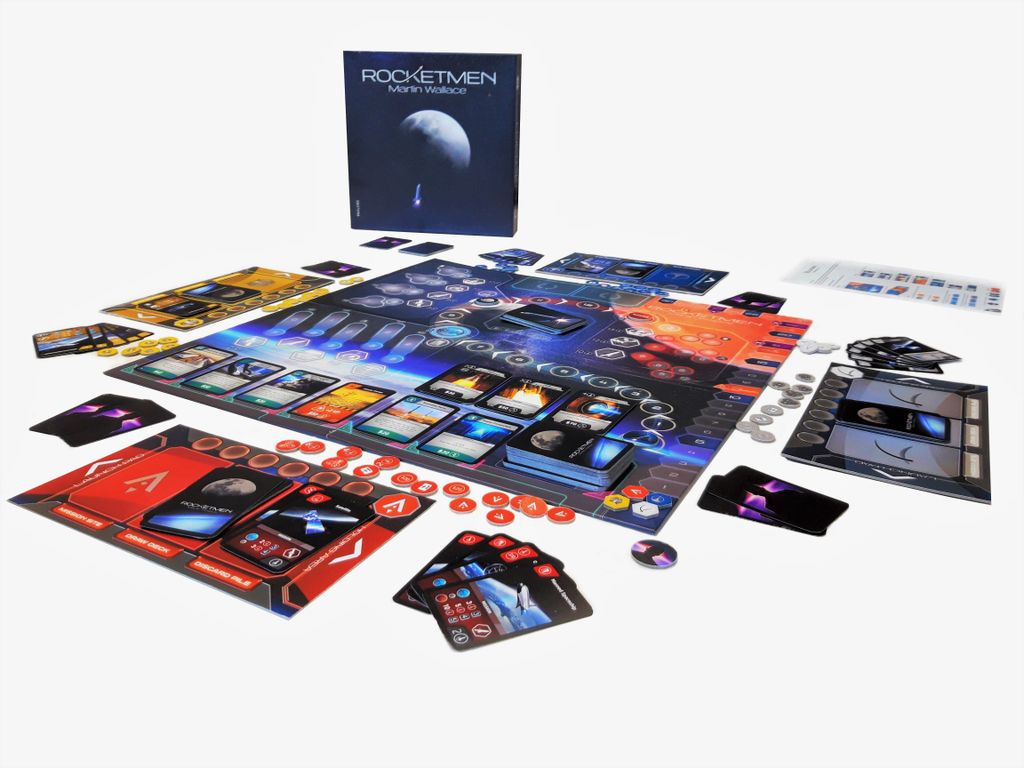 The Rocketmen board game by Phalanx is set up with a space-themed central board, cards, tokens, player mats, and the upright game box in the background.