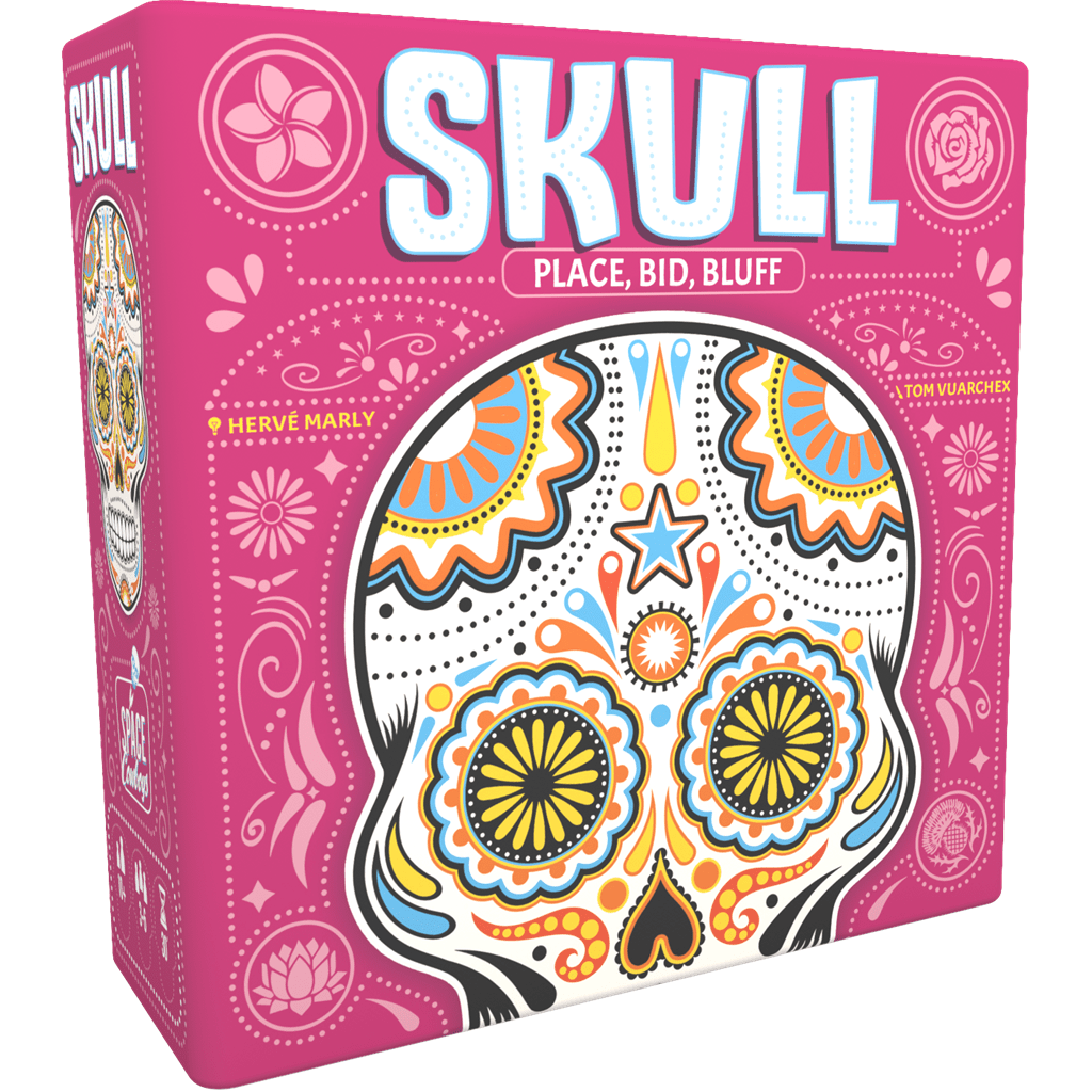 A pink box for the Skull board game by Space Cowboys, featuring vibrant Day of the Dead-inspired skull art and bold SKULL lettering. Includes the tagline "Place, Bid, Bluff" for this risk-taking bluffing game.