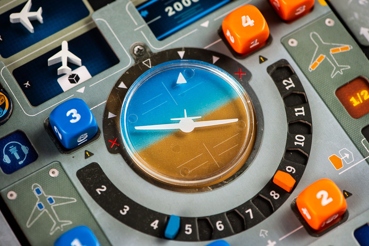 A close-up of Kosmos' Sky Team (German Version), a vibrant board game featuring a central circular dial, airplane icons, numbered buttons, and markers—ideal for fans of aviation-themed cooperative play.