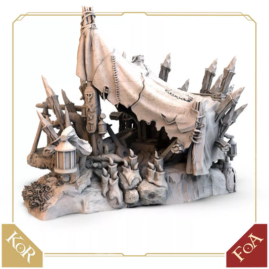 A detailed miniature fantasy tent from Awaken Realms’ Tainted Grail: Modular Campsite Expansion, featuring stitched fabric, wooden stakes, terrain, lanterns, skulls, and totems. Kings of Ruin and Fall of Avalon logos appear in the image corners.