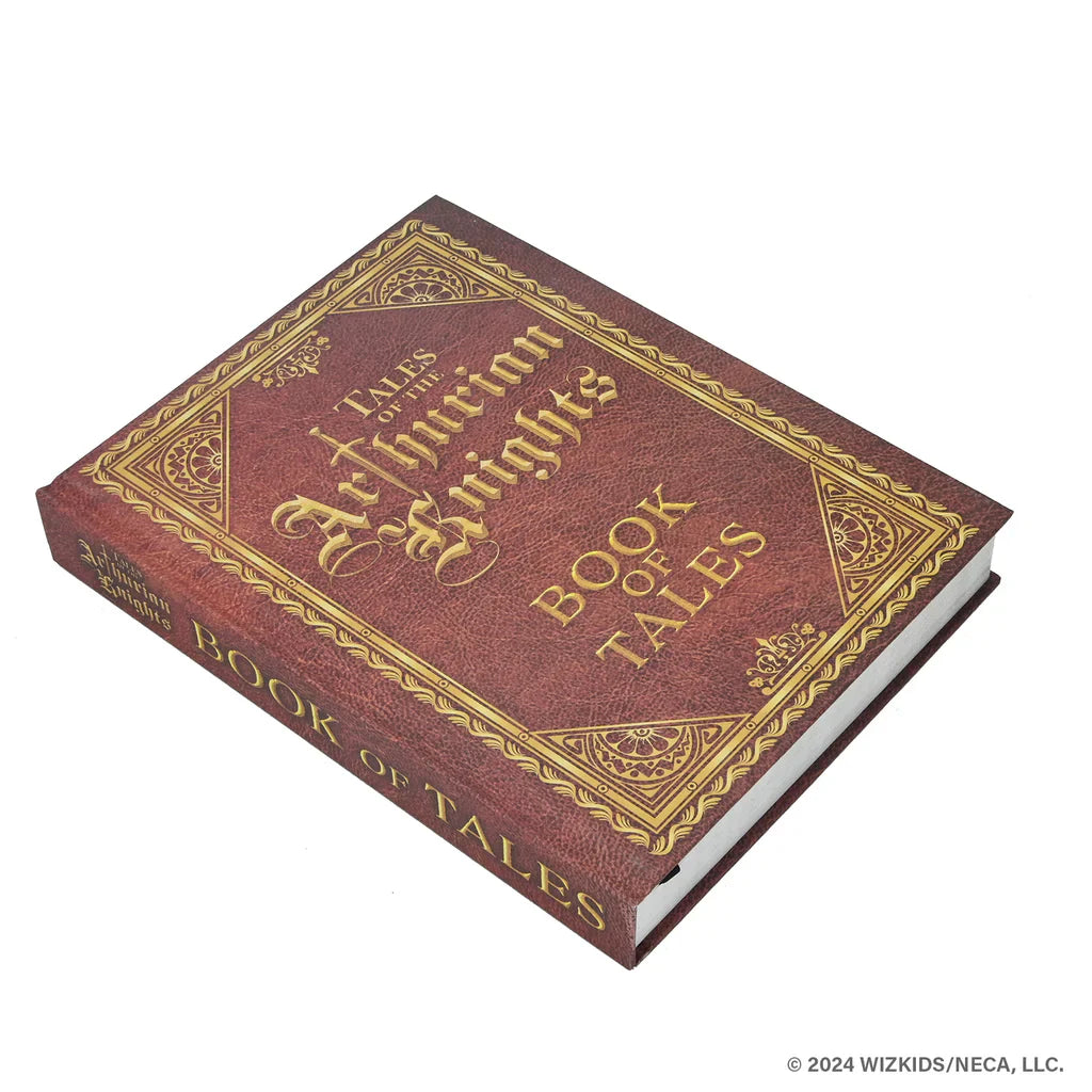 The hardcover Tales of the Arthurian Knights (Damaged) by WizKids, with ornate gold details on a brown cover, evokes King Arthur’s legendary world as it rests elegantly on a white surface.