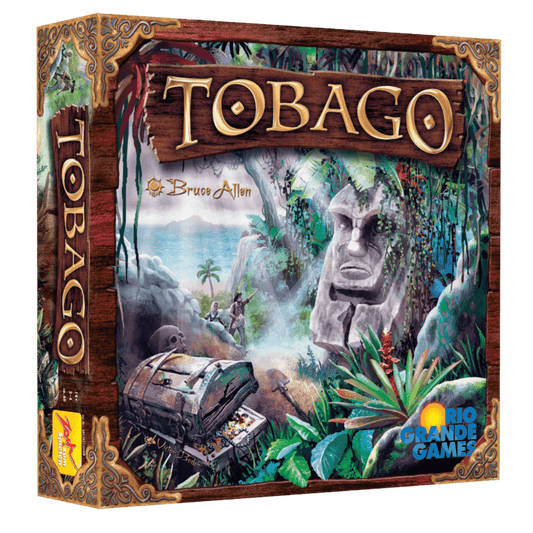 The box cover of Tobago by Rio Grande Games features a lush jungle, giant stone face, treasure chest, palm trees, and distant coastline, with the title "Tobago" in large gold letters at the top.