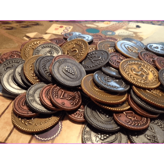 Viticulture Metal Lira Coins by Stonemaier Games feature ornate silver, bronze, and gold designs with engraved numbers, perfect for enhancing any Euro game experience. Scattered on the board, they add a decorative and authentic touch to your games.