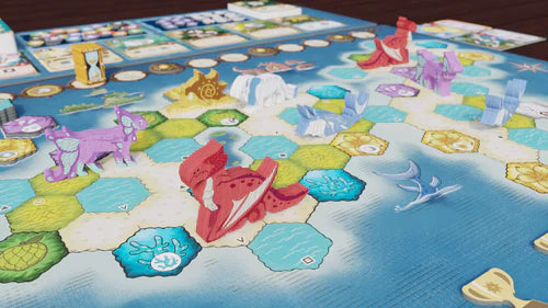 Wondrous Creatures: Crew Set Expansion by Bad Comet is a colorful strategy game with hexagonal ocean and island tiles, wooden dinosaur and aquatic animal pieces in red, purple, and white, plus Crew Cards and various tokens.
