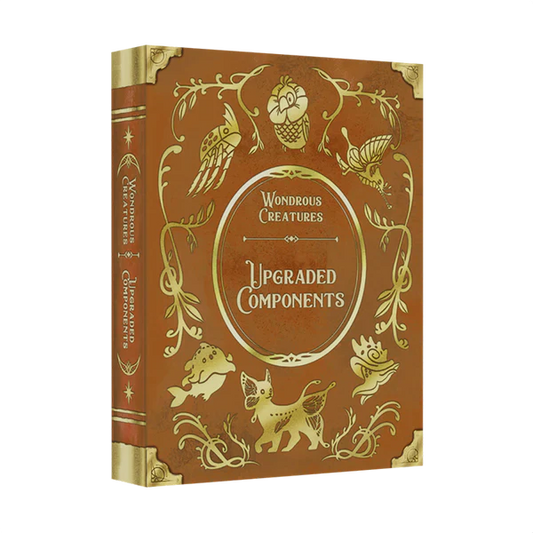 The Wondrous Creatures: Upgraded Components Expansion by Bad Comet is a decorative brown hardcover with gold-embossed whimsical animal illustrations, perfect for fans of unique wooden or metal upgrades.
