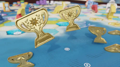 Wondrous Creatures: Upgraded Components Expansion by Bad Comet features hexagonal tiles, game pieces, and upgraded wooden and metal trophy icons for rewards, all set on a blue board background.