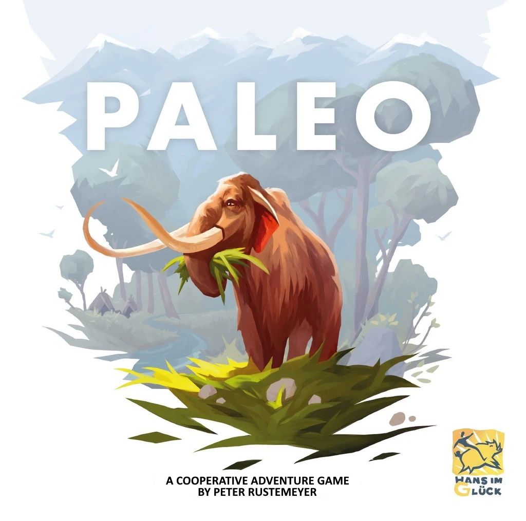 A woolly mammoth stands in green grass with mountains behind and blue sky above. Large white text says PALEO. The bottom reads: Paleo board game, a cooperative adventure from Z-Man Games.