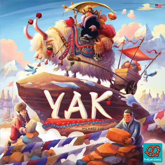 The Yak board game by Asmodee Italia features a cover where a yak pulls a cart with a rider, two people build a stone tower, and "YAK" is displayed on a rock amid snowy villages and the Himalayan mountains.