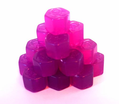 A small pyramid of translucent, hexagonal, pink and purple gummy candies stacked on a white background—an ideal playful snack while taking over the world in your next Plague Inc. session from Ndemic Creation.